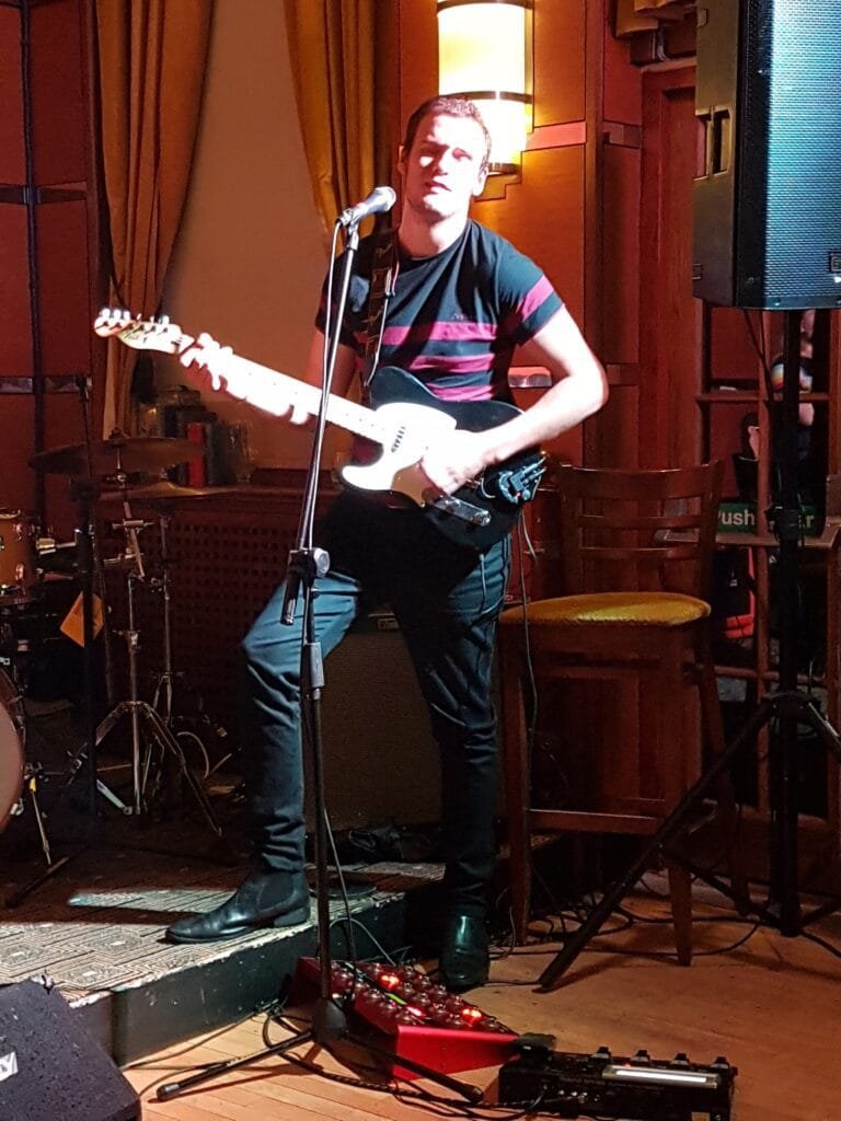 Jack-Donald-playing-guitar-at-The-Test-Match